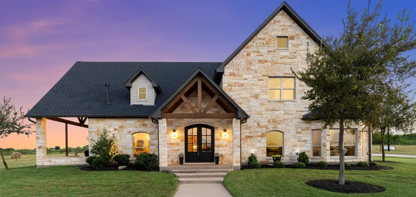 Stone home exterior at sunset